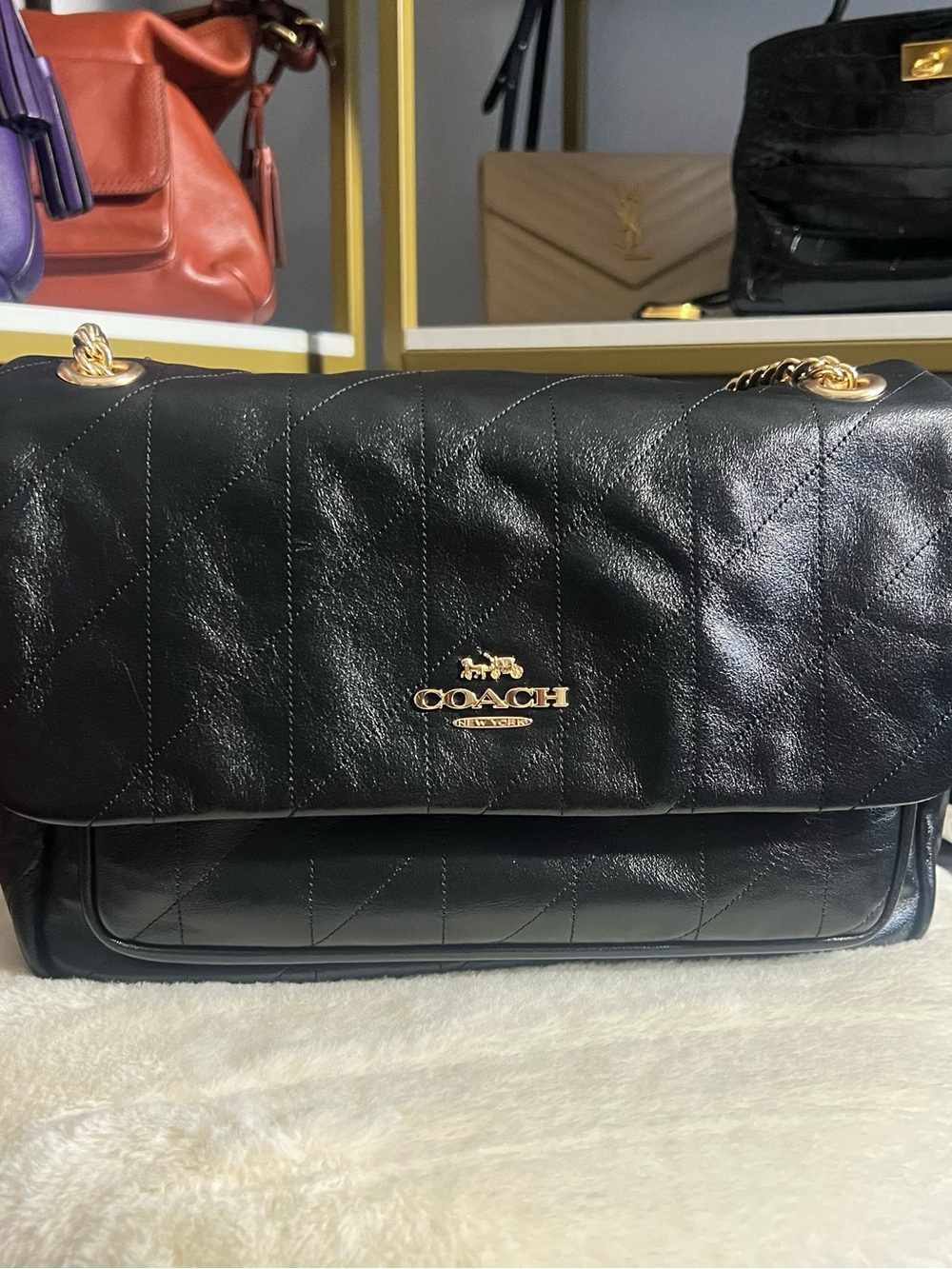 Coach Elodie in quilted leather and gold hardware